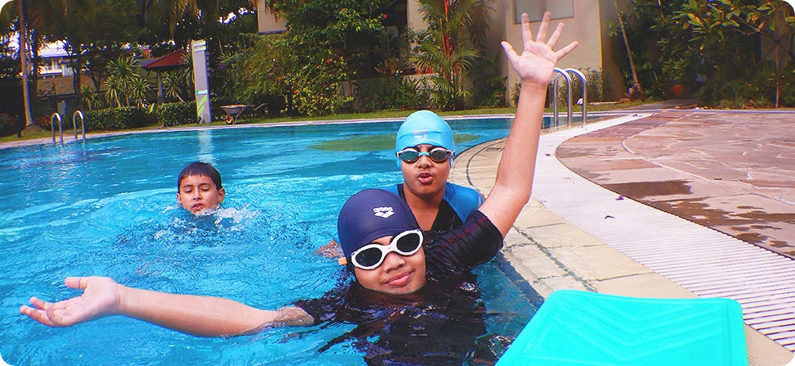Children having fun during swimming lessons at Friendly Dolphin
